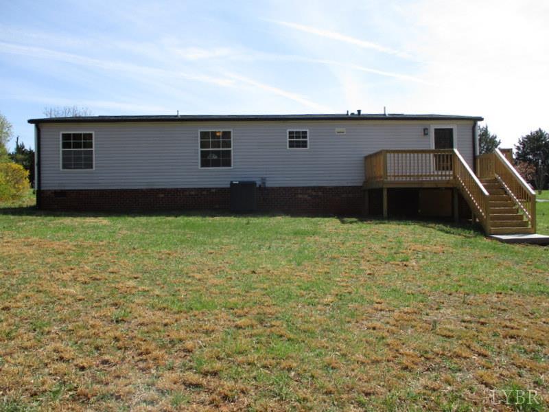 5629 Gladys Road Altavista, VA 24517 - Photo 28 of 29 a backyard of a house with yard and barbeque oven