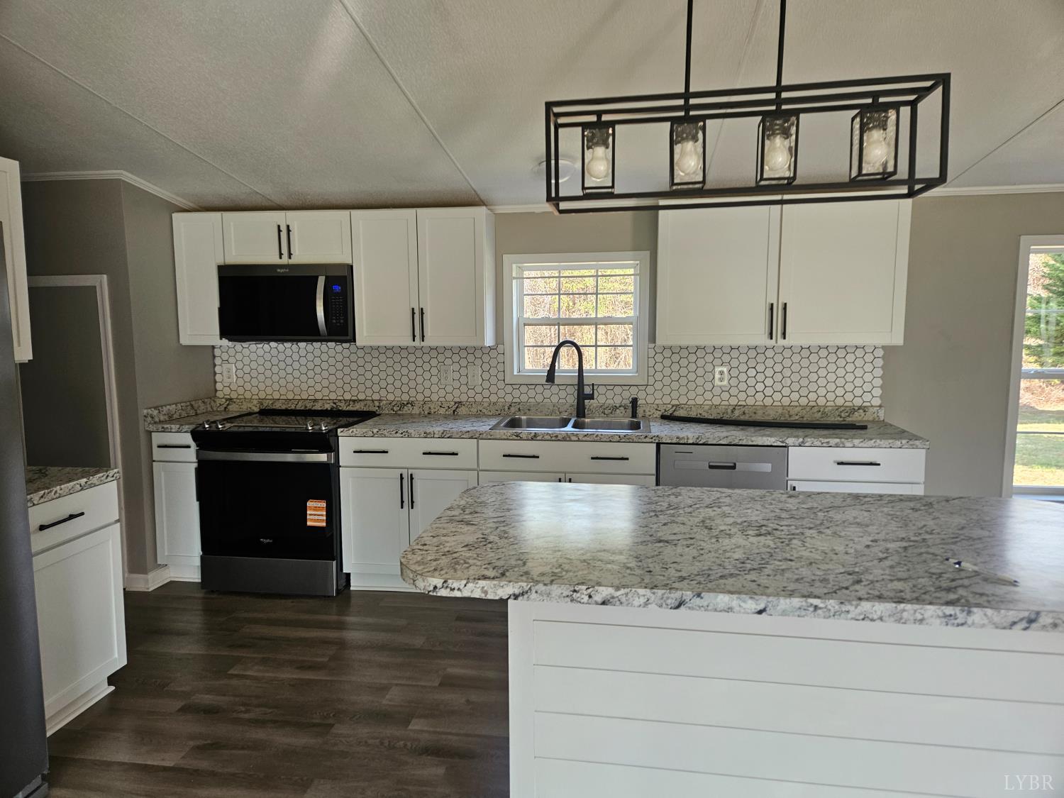 5629 Gladys Road Altavista, VA 24517 - Photo 5 of 29 a kitchen with stainless steel appliances granite countertop a sink and a stove