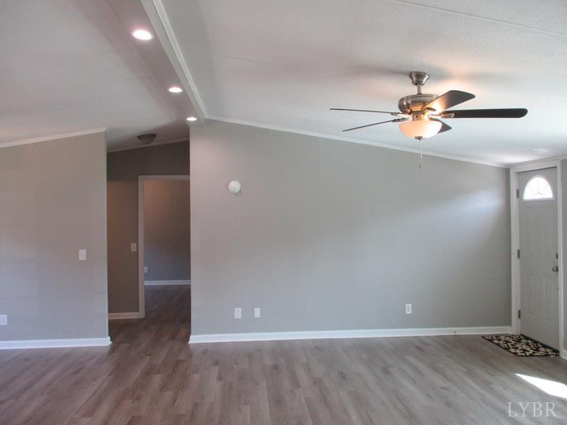 5629 Gladys Road Altavista, VA 24517 - Photo 10 of 29 wooden floor in an empty room with a window