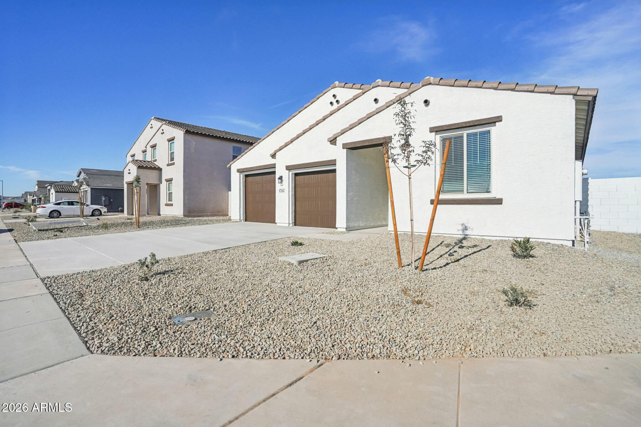 47162 West Cansados Road Maricopa, AZ 85139 - Photo 3 of 50 a view of a house with large windows