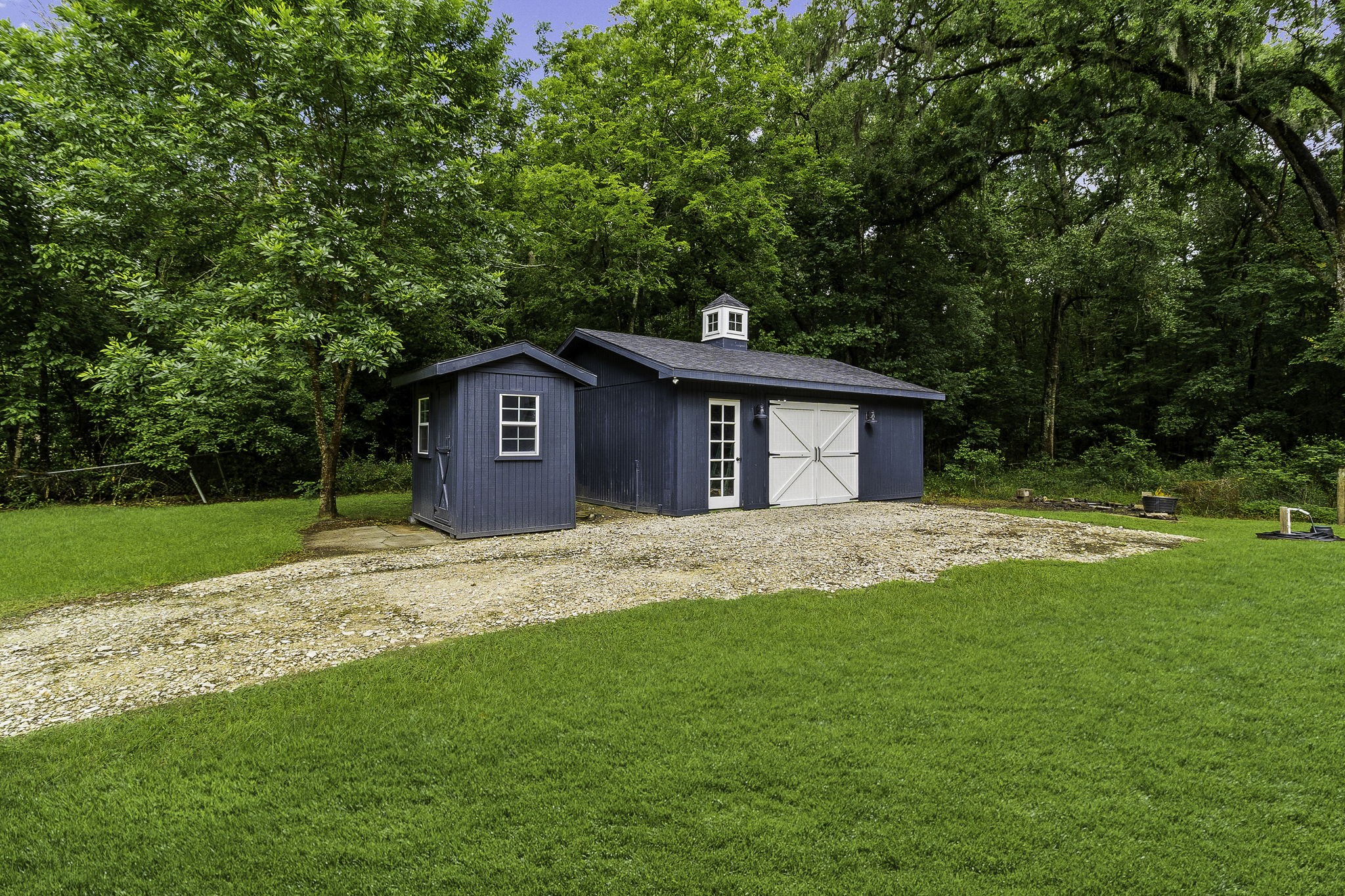 600 Wilderness Road Point Blank, TX 77364 - Photo 25 of 28 Garage/workshop offers flexible space for hobbies, lake toys, tools , or workshop use.