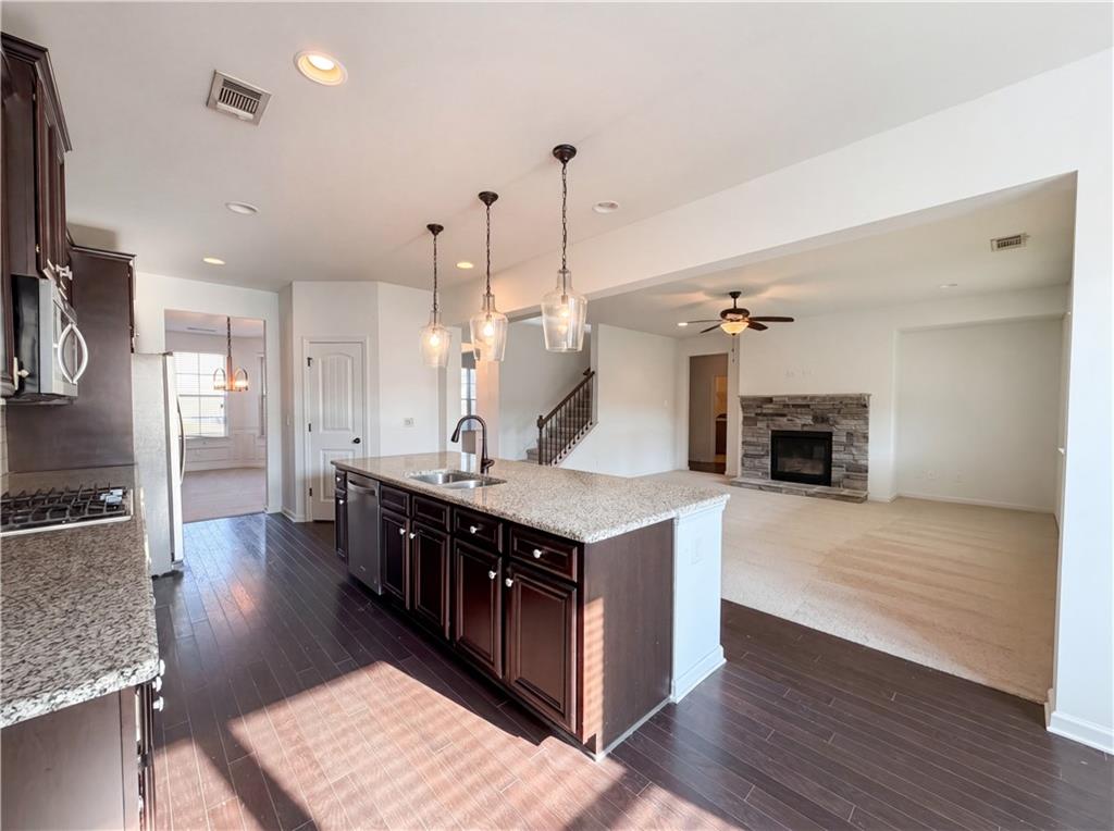 307 Valley View Trail Dallas, GA 30132 - Photo 11 of 41 a kitchen with a stove and a wooden floor