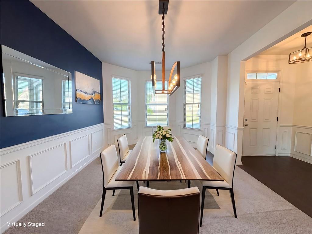 307 Valley View Trail Dallas, GA 30132 - Photo 12 of 41 a view of a dining room with furniture window and wooden floor