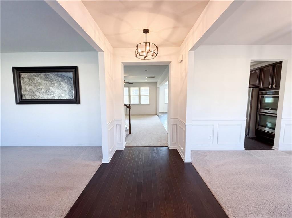 307 Valley View Trail Dallas, GA 30132 - Photo 14 of 41 wooden floor in an empty room with a window