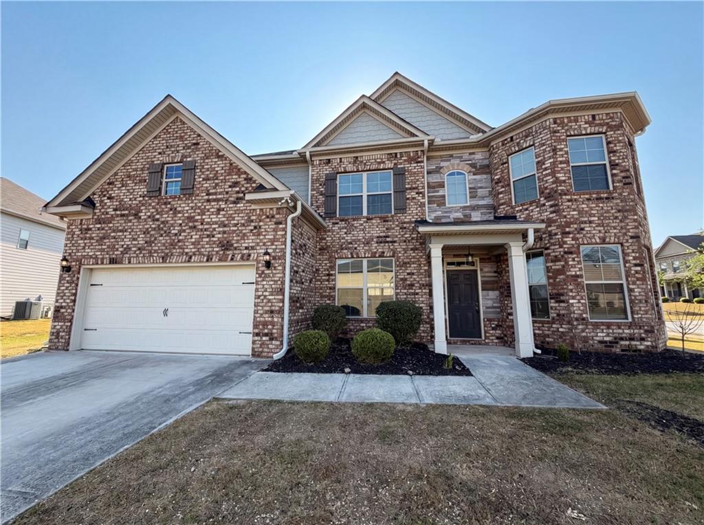 307 Valley View Trail Dallas, GA 30132 - Photo 2 of 41 a front view of a house with a yard and garage