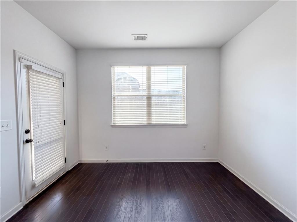 307 Valley View Trail Dallas, GA 30132 - Photo 27 of 41 an empty room with wooden floor and windows