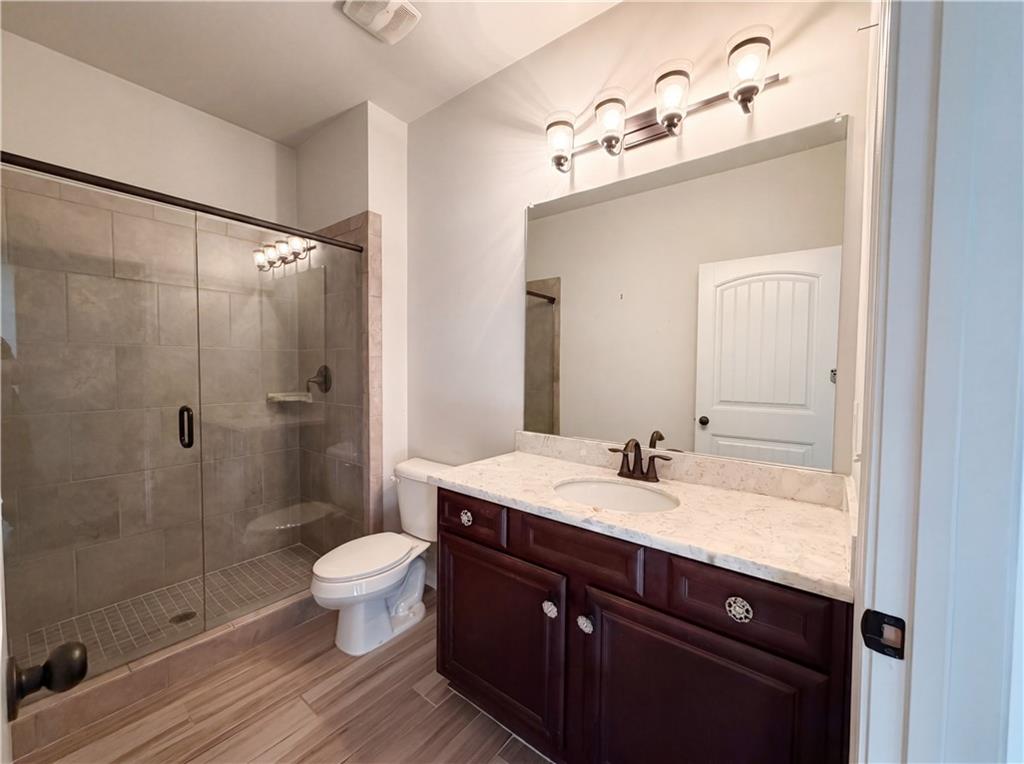307 Valley View Trail Dallas, GA 30132 - Photo 30 of 41 a bathroom with a sink a toilet and shower