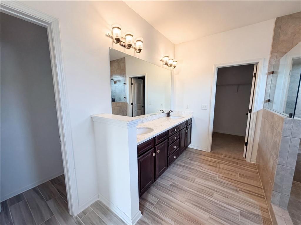 307 Valley View Trail Dallas, GA 30132 - Photo 33 of 41 a bathroom with a double vanity sink and mirror