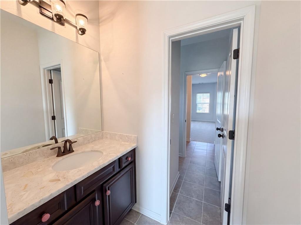 307 Valley View Trail Dallas, GA 30132 - Photo 36 of 41 a bathroom with a sink vanity granite tub and shower