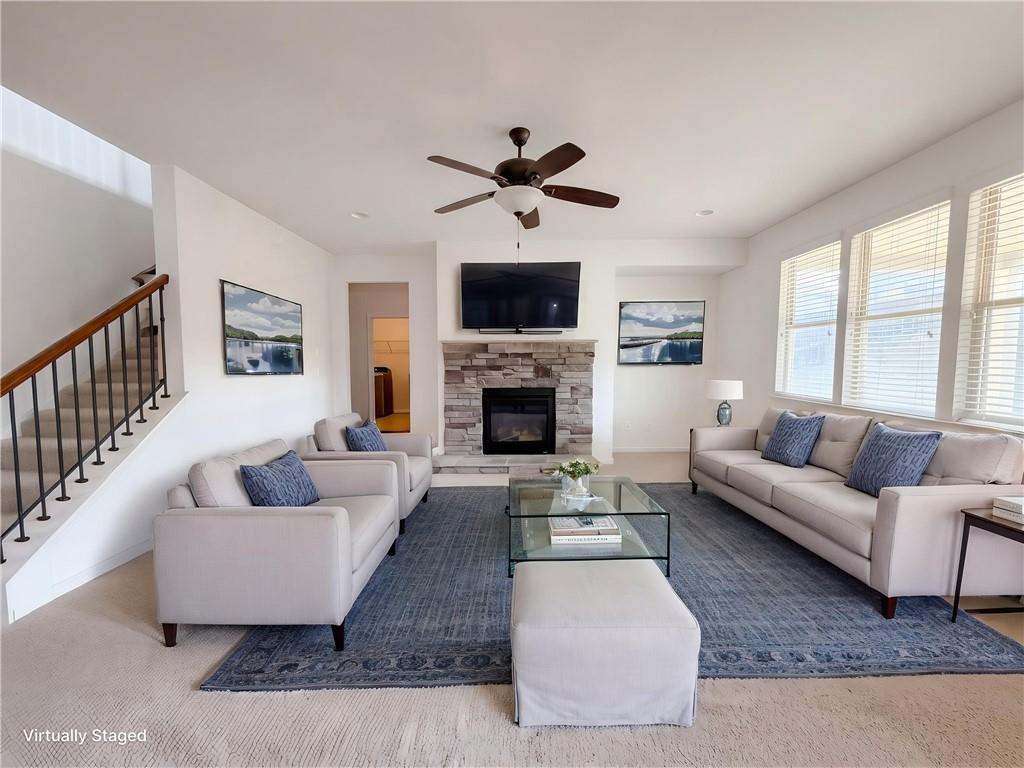 307 Valley View Trail Dallas, GA 30132 - Photo 4 of 41 a living room with furniture a flat screen tv and a fireplace