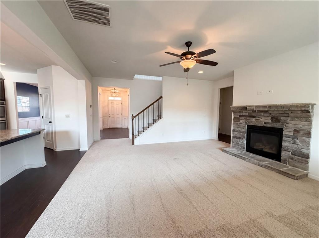 307 Valley View Trail Dallas, GA 30132 - Photo 6 of 41 a view of a livingroom with a fireplace and a ceiling fan