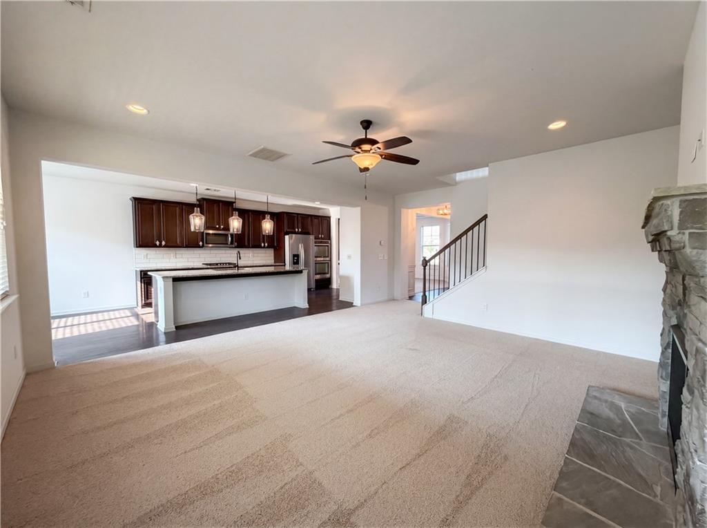 307 Valley View Trail Dallas, GA 30132 - Photo 7 of 41 a view of an empty room with a kitchen and a window