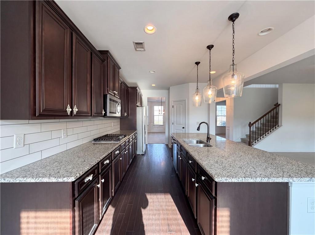 307 Valley View Trail Dallas, GA 30132 - Photo 8 of 41 a kitchen with granite countertop a sink a counter top space and cabinets