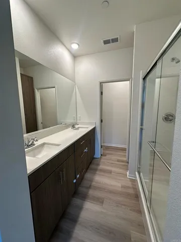 a kitchen with stainless steel appliances granite countertop a refrigerator microwave and sink