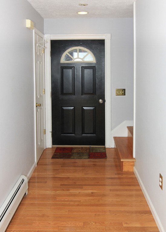 15 Cross Street Chicopee, MA 01013 - Photo 5 of 15 a view of a hallway with wooden floor
