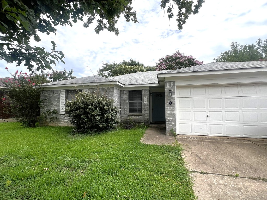 3503 Walleye Way Round Rock, TX 78665 - Photo 9 of 10 Single story home with brick siding, a front lawn, and roof with shingles