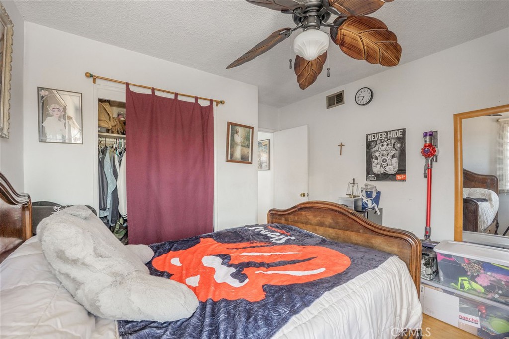 2905 Rindge Lane Redondo Beach, CA 90278 - Photo 17 of 26 a bedroom with a bed and ceiling fan