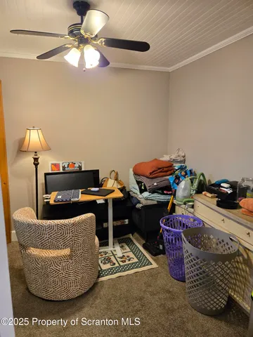 a living room with furniture and a lamp