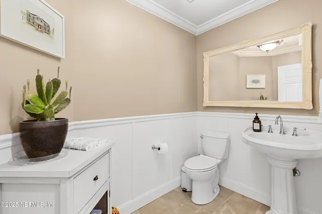 a spacious bedroom with a large bed and a fireplace