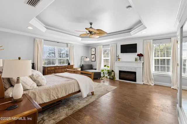 a spacious bathroom with a granite countertop sink and a mirror