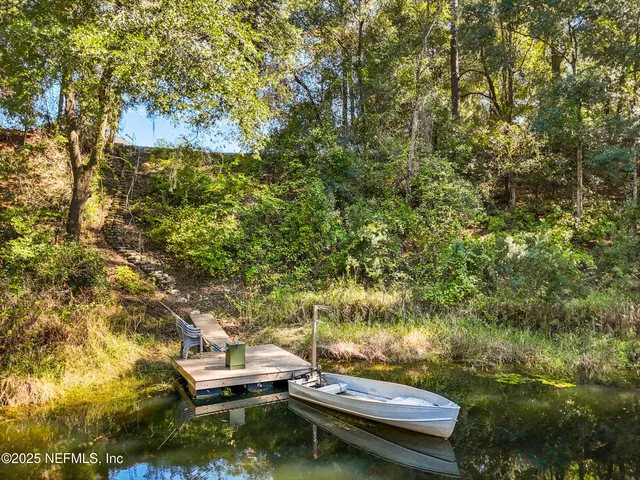 a backyard of a house with lots of trees