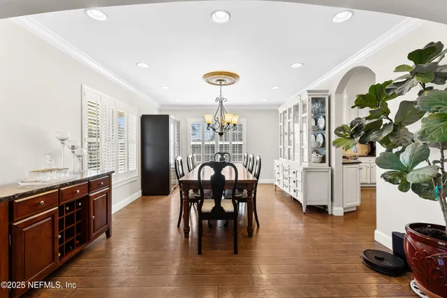 a large kitchen with a table and chairs