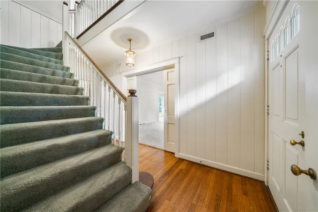 a view of entryway with wooden floor