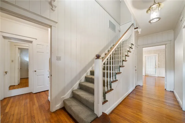 a view of staircase with wooden floor and staircase
