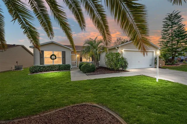 a view of a house with a yard