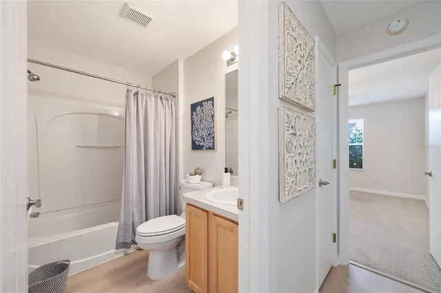 a bathroom with a toilet a sink and a shower