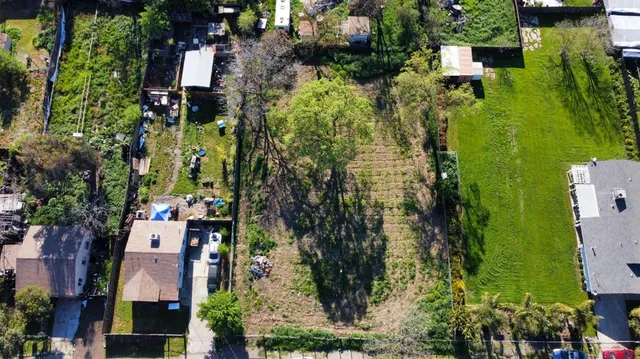 an aerial view of houses with outdoor space