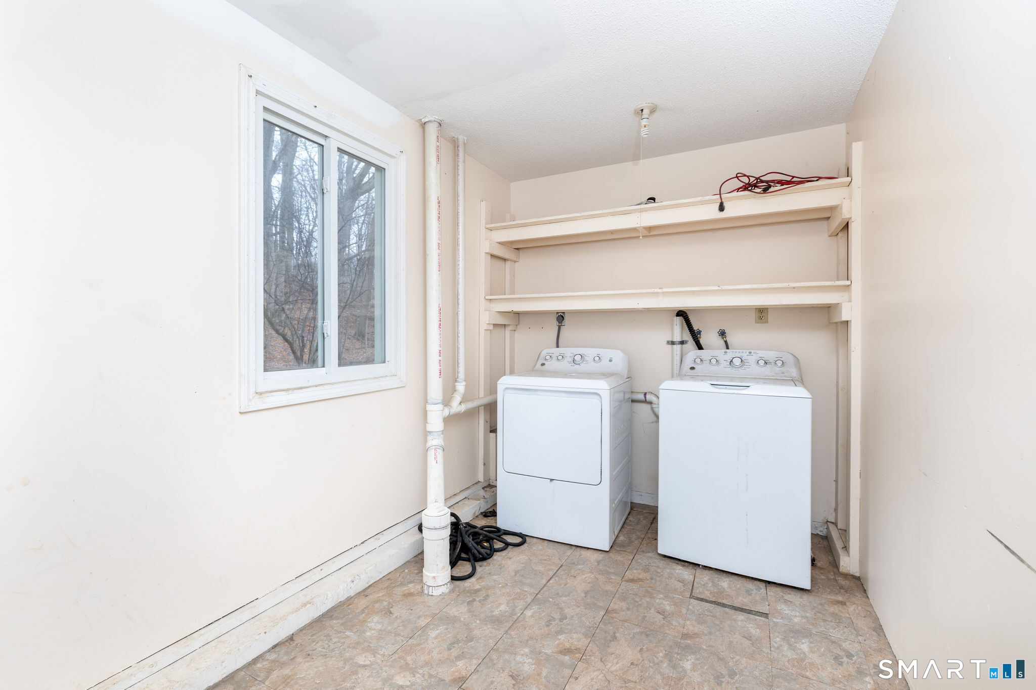 67 Woodland Ridge, Unit 67 Meriden, CT 06450 - Photo 24 of 33 a utility room with dryer and washer