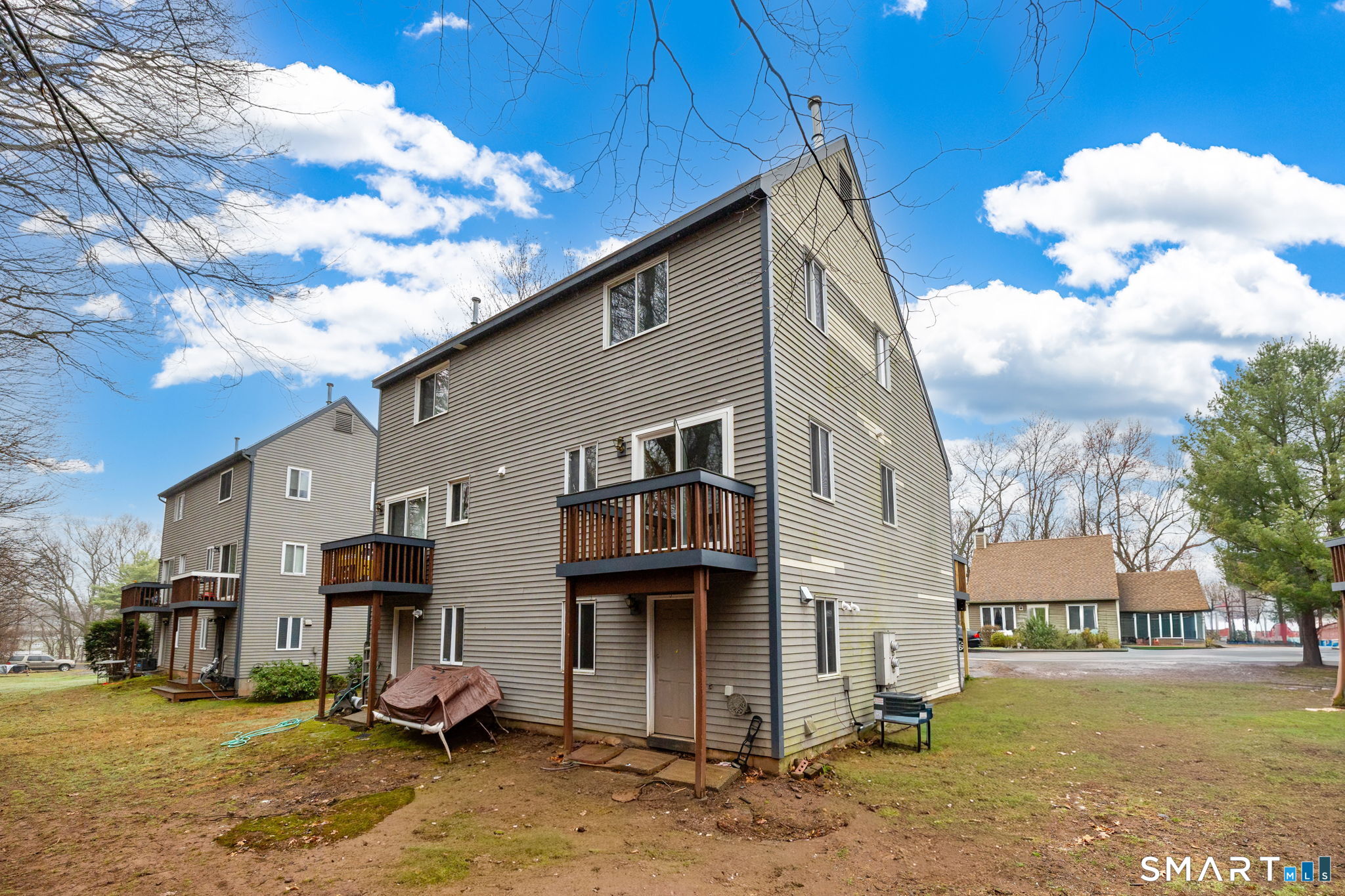 67 Woodland Ridge, Unit 67 Meriden, CT 06450 - Photo 25 of 33 a view of a house with a backyard