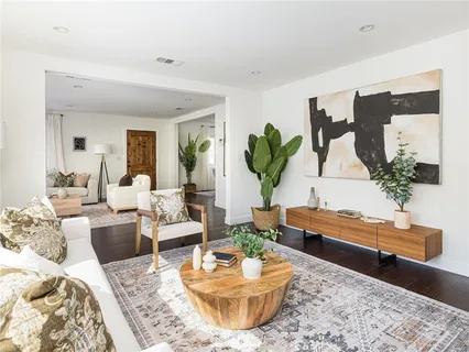 a kitchen with white cabinets and a sink