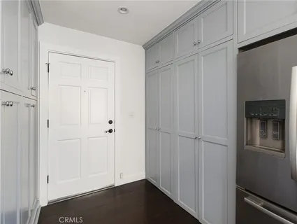a bathroom with a granite countertop sink a toilet and a mirror