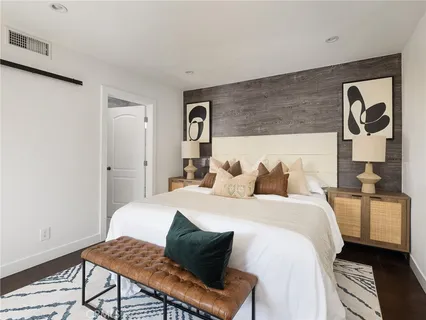 a bedroom with bed and a window