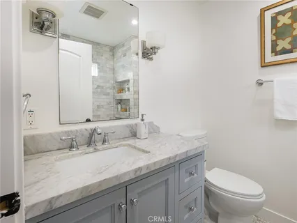 a bed room with a bed and a chair