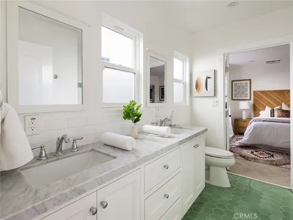 a view of a chair and table in the garden