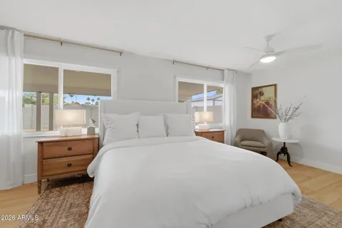 a bedroom with a bed and window