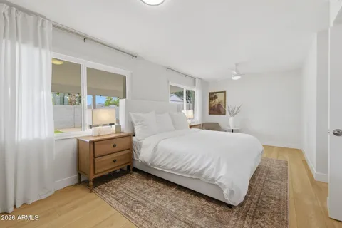 a bedroom with a bed and window