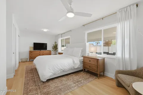 a bedroom with a bed and furniture