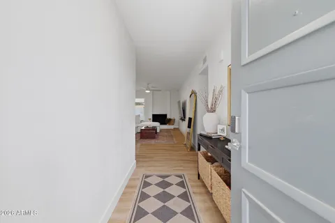 a hallway with a white stove top oven and a refrigerator