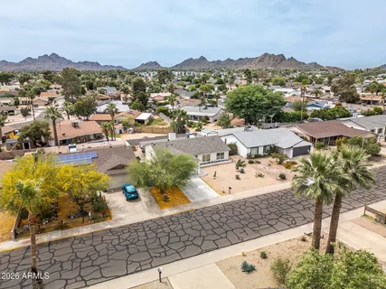an aerial view of residential houses with outdoor space