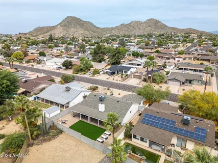 an aerial view of residential houses with outdoor space