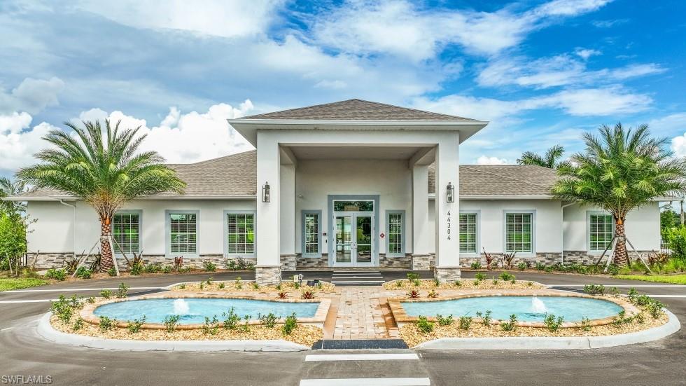 17752 Shade Tree Loop Punta Gorda, FL 33982 - Photo 14 of 40 a view of a house with swimming pool and a dining table and chairs