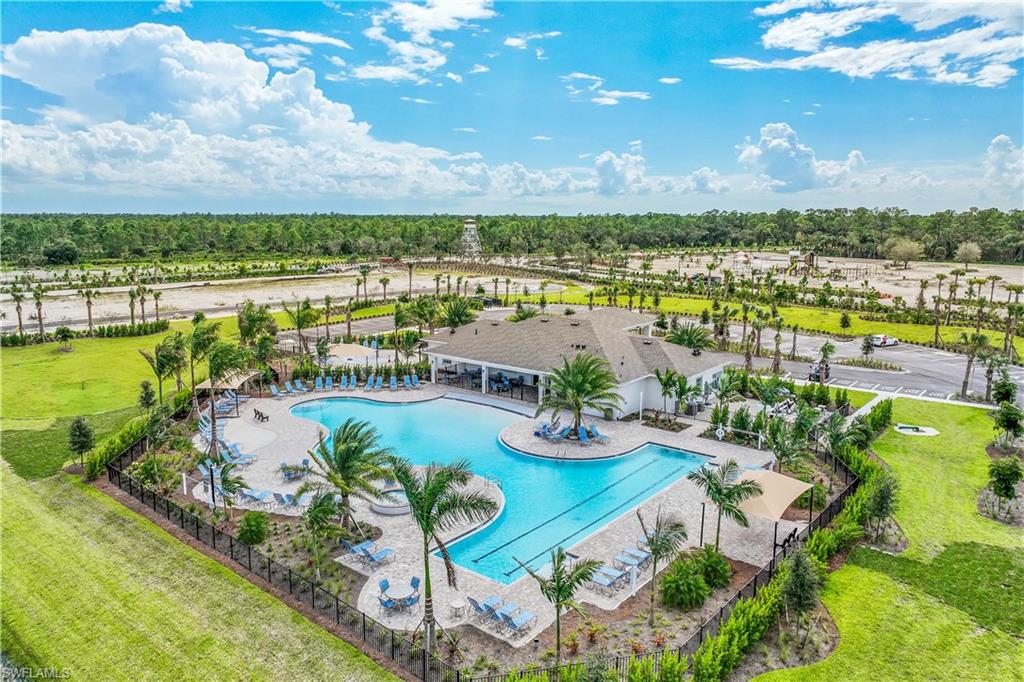 17752 Shade Tree Loop Punta Gorda, FL 33982 - Photo 35 of 40 View of swimming pool with a yard and a patio area