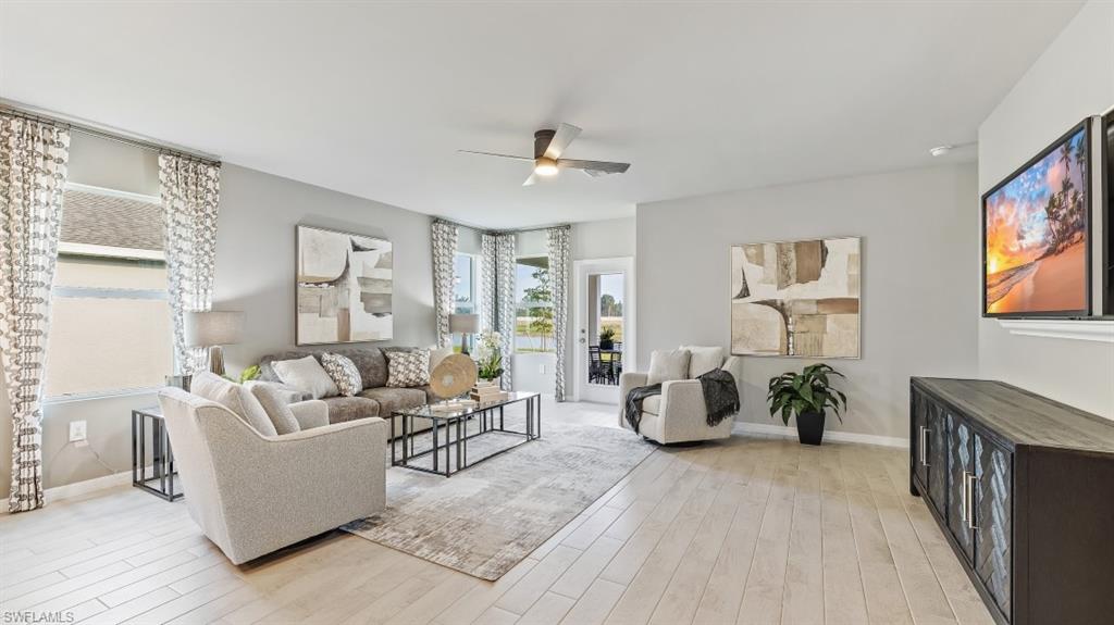 17752 Shade Tree Loop Punta Gorda, FL 33982 - Photo 4 of 40 a living room with furniture and wooden floor