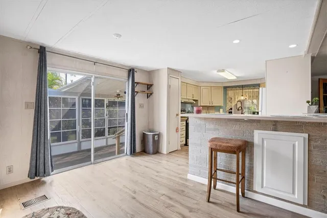 a kitchen with a table and chairs