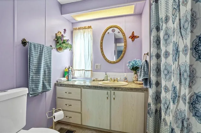 a bedroom with furniture and windows