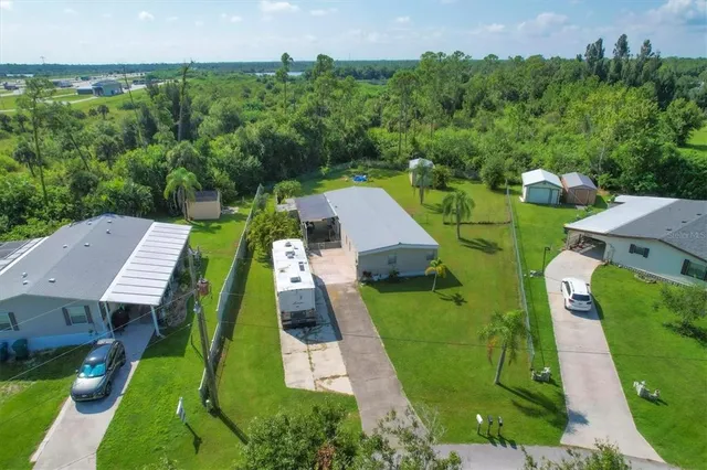a view of a porch with furniture and floor to ceiling window